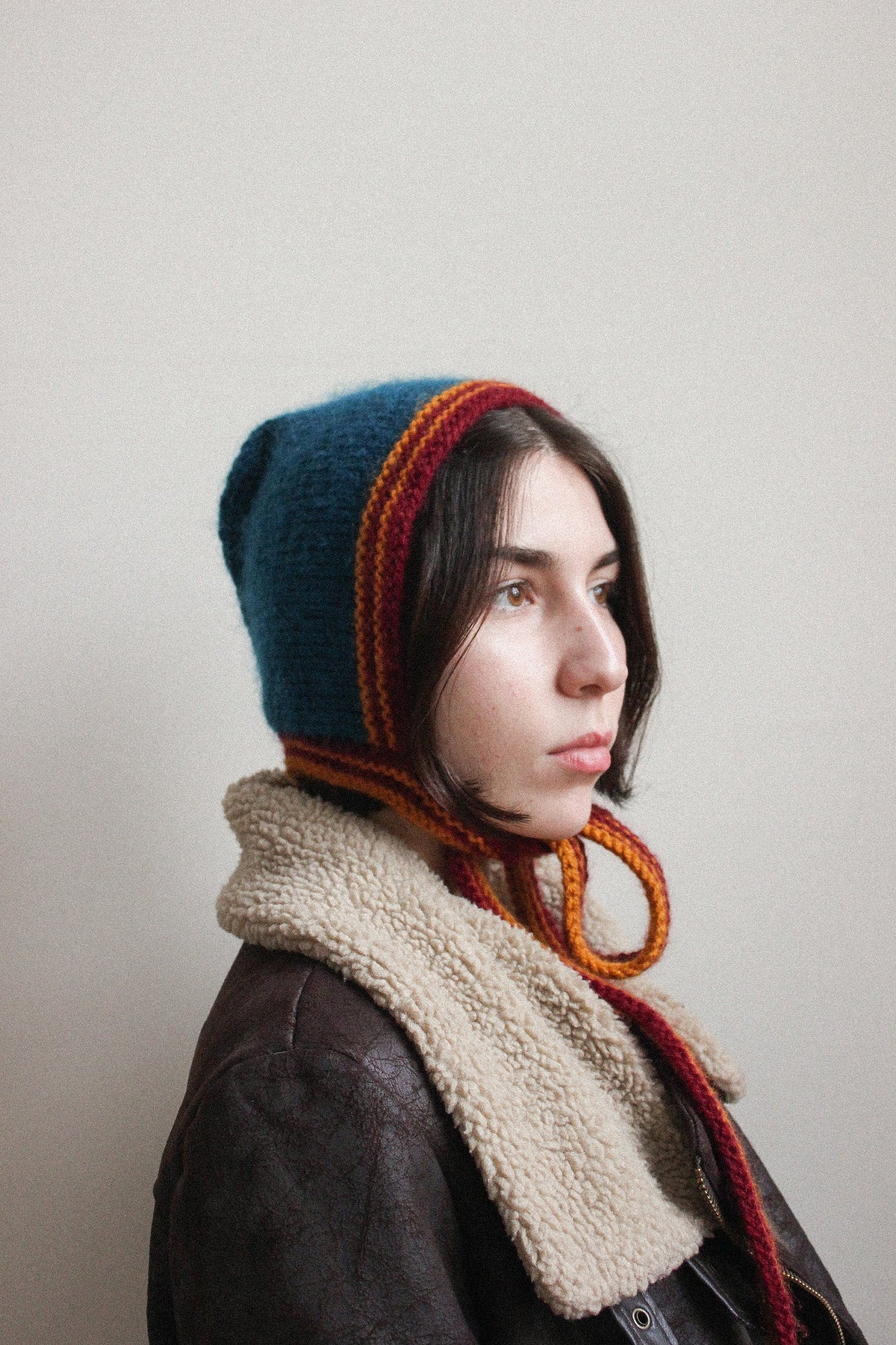 Hand-knitted Adult Bow Tie Bonnet hat in dull multicolor