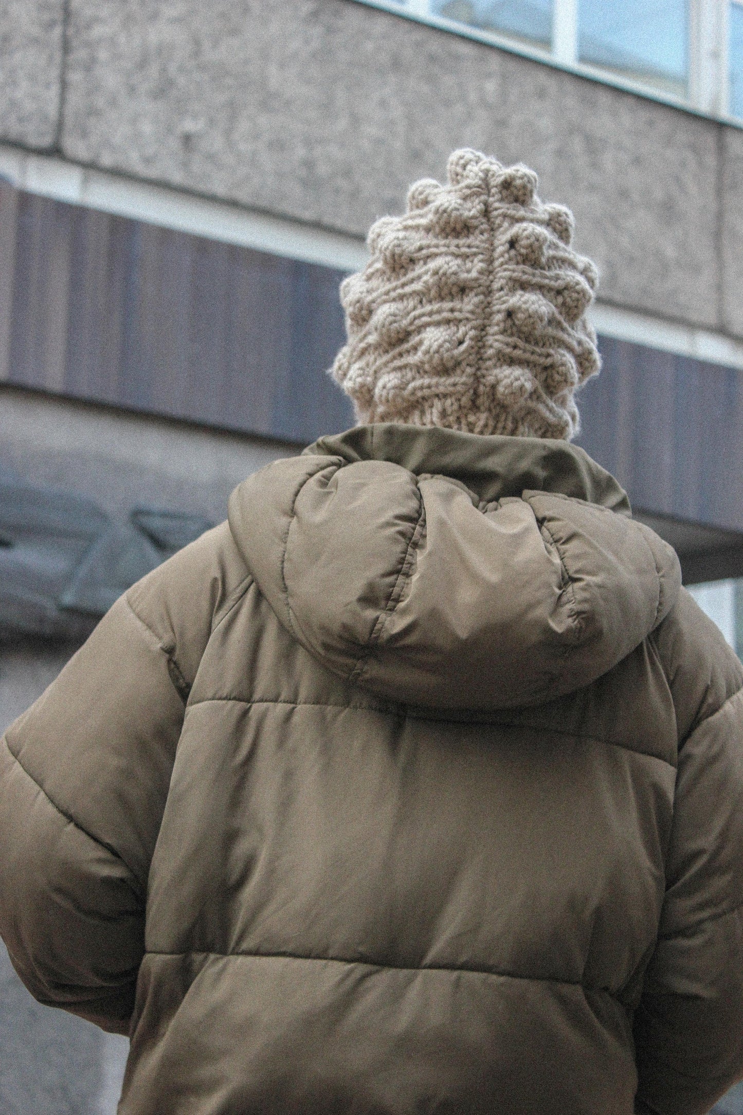 Balaclava with dimensional tuck knitting technique in Beige