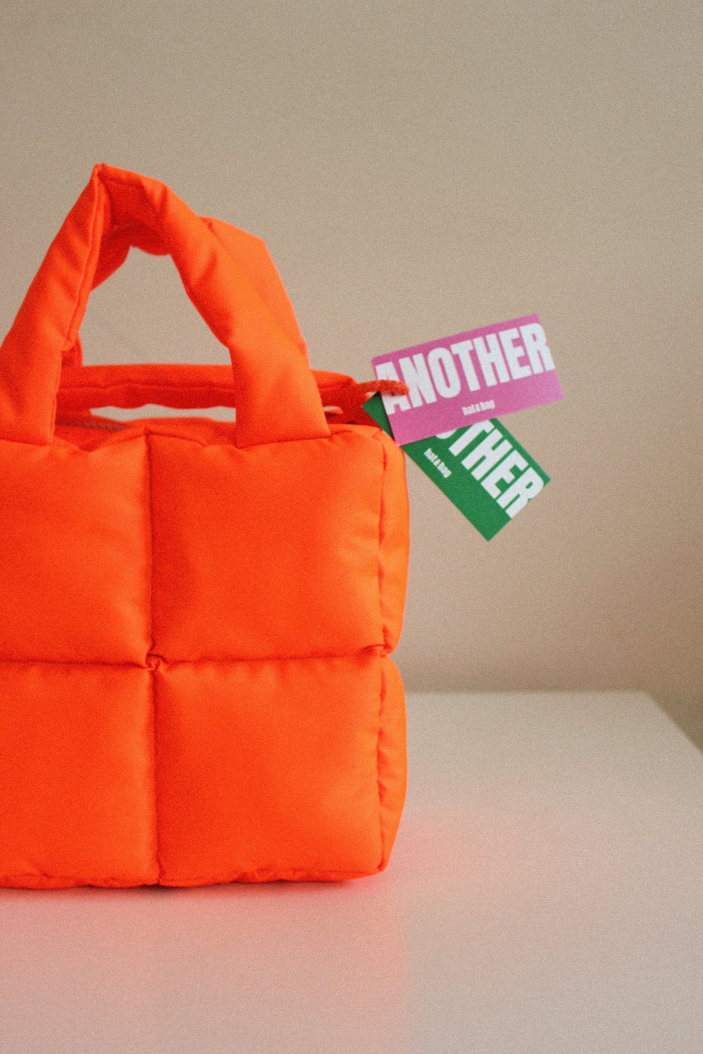 Mini Pillow Puffer Essential bag in Neon Mandarin