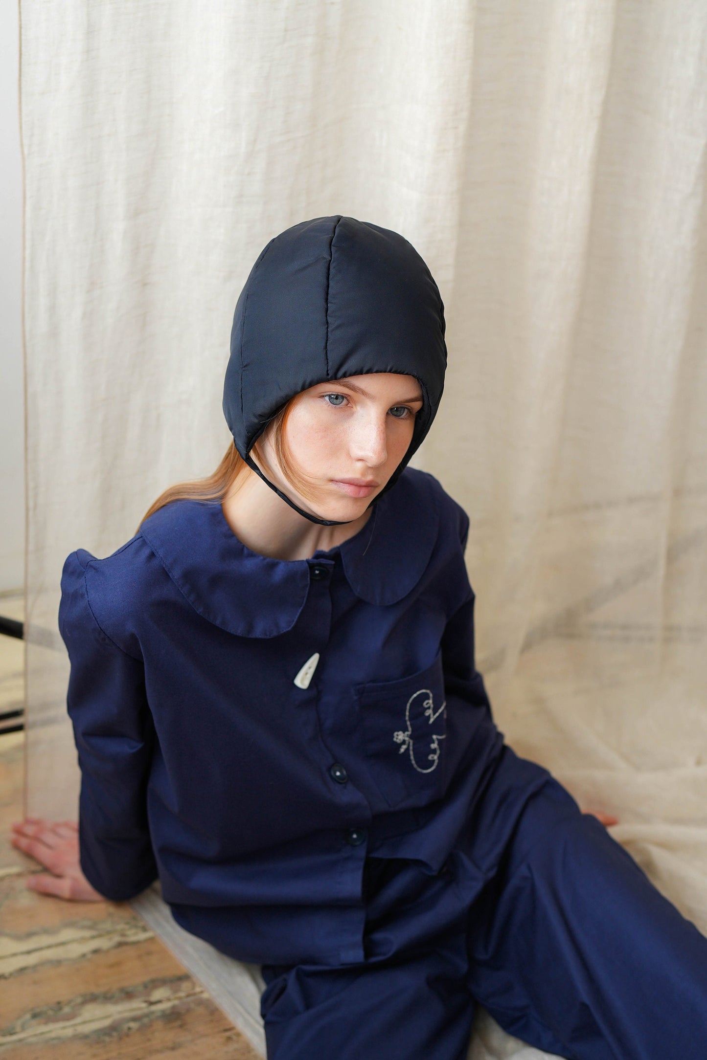 Pillow Puffer Quilted Aviator Helmet Cap Bonnet on a button in Black