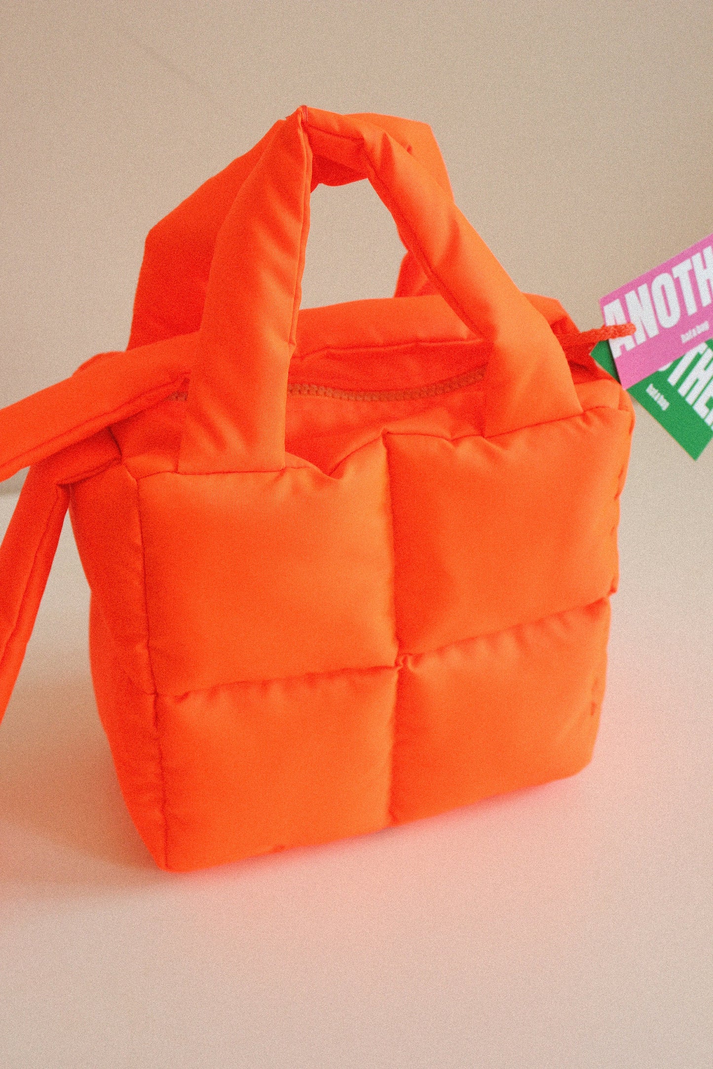 Mini Pillow Puffer Essential bag in Neon Mandarin