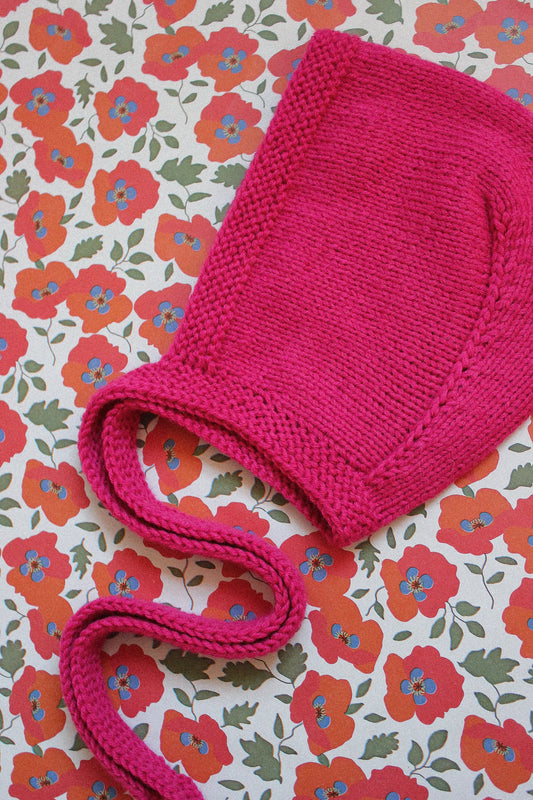 Hand-knitted Adult Bow Tie Bonnet hat in Hot Pink