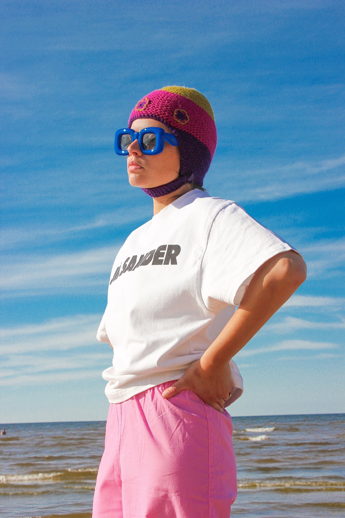 Multicolored Aviator Bonnet Hat with crochet flowers