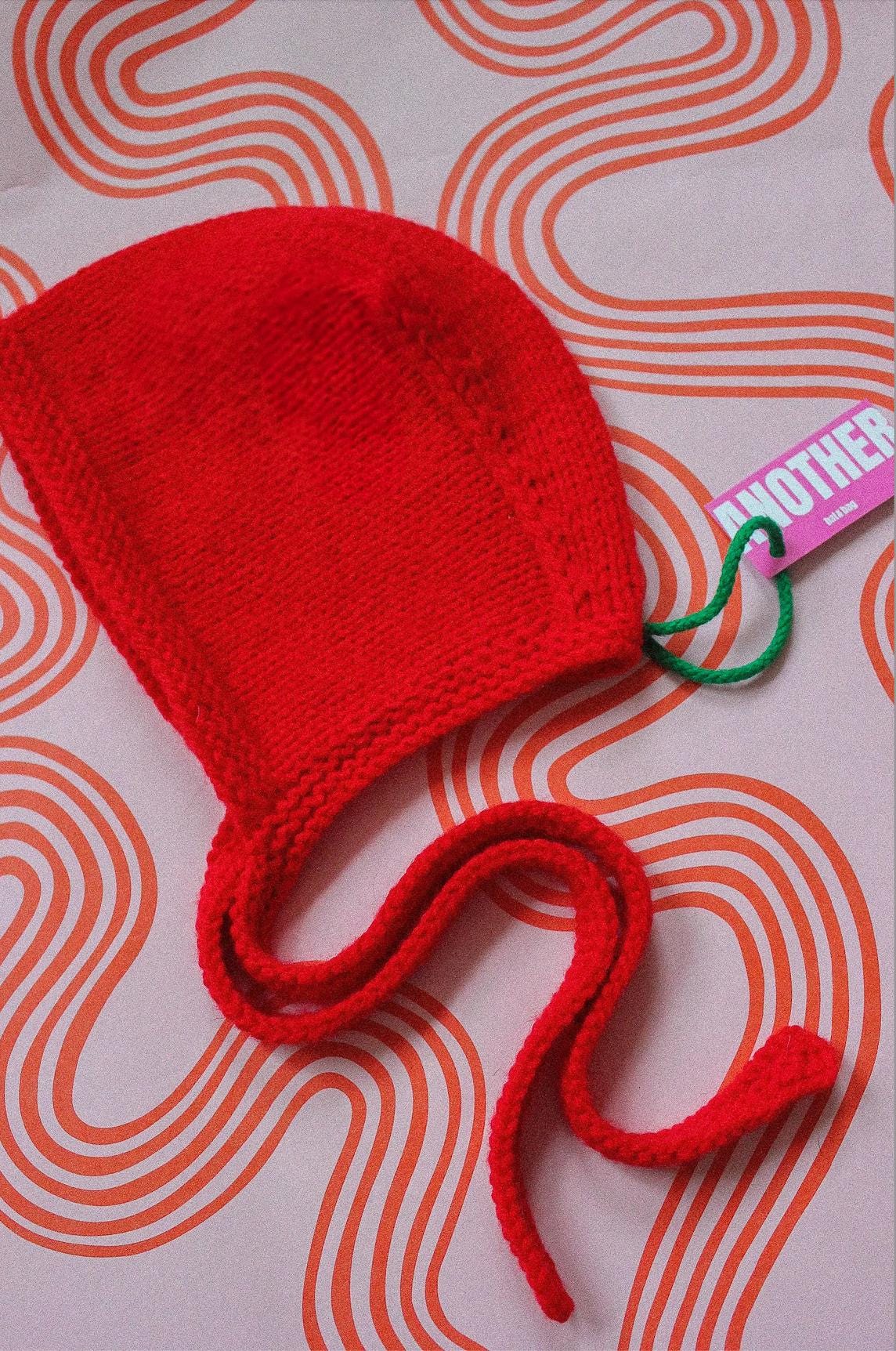 Hand-knitted Adult Bow Tie Bonnet hat in Hot Red