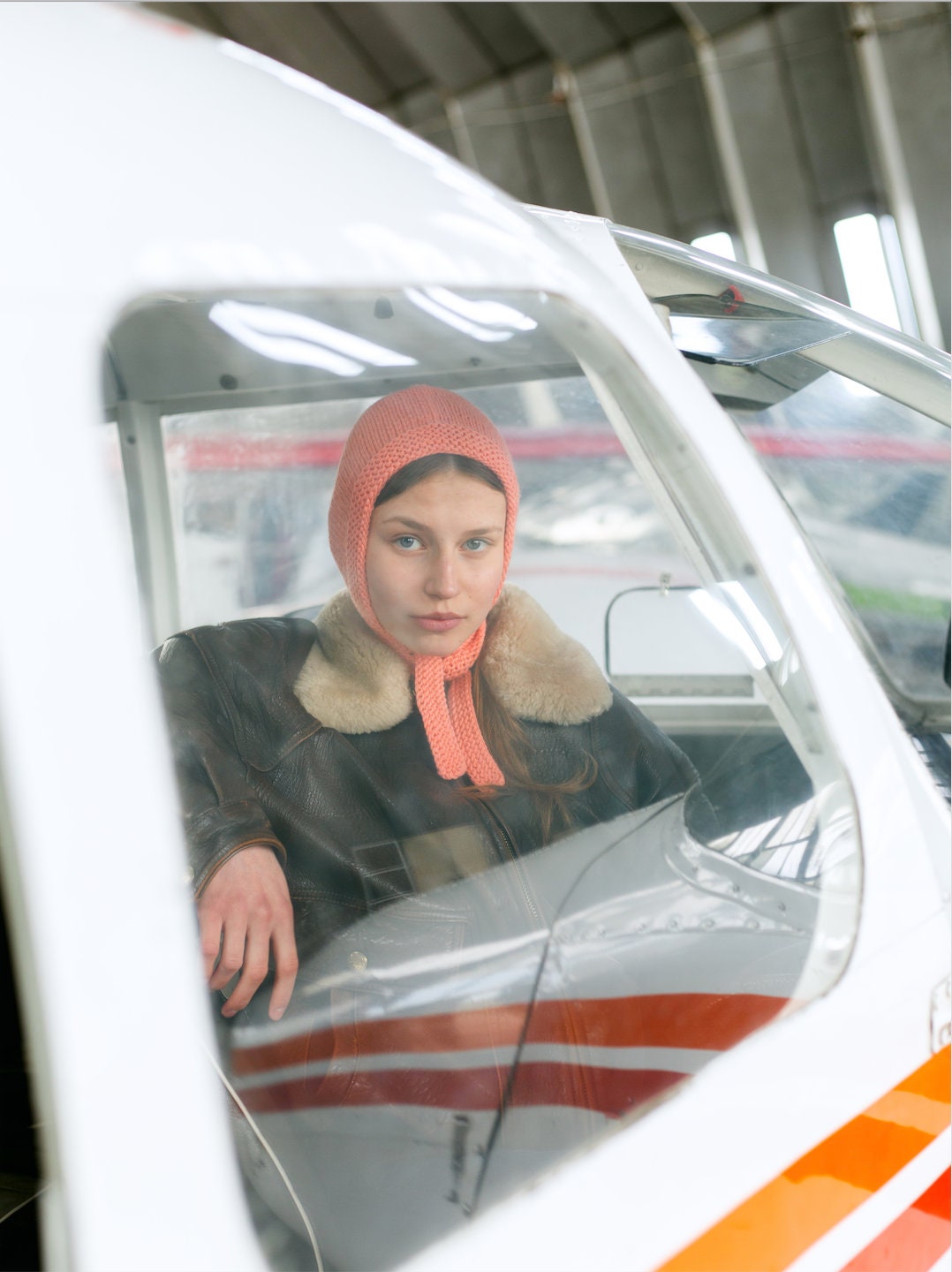 Hand-knitted Adult Bow Tie Bonnet hat in Peach Fuzz