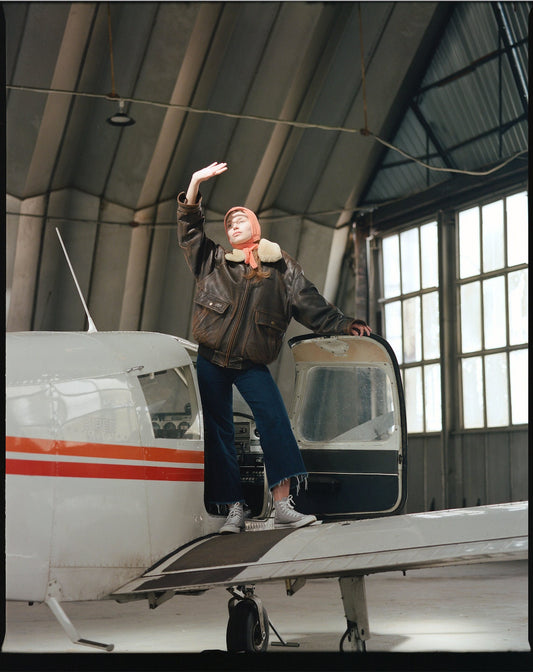 Hand-knitted Adult Bow Tie Bonnet hat in Peach Fuzz