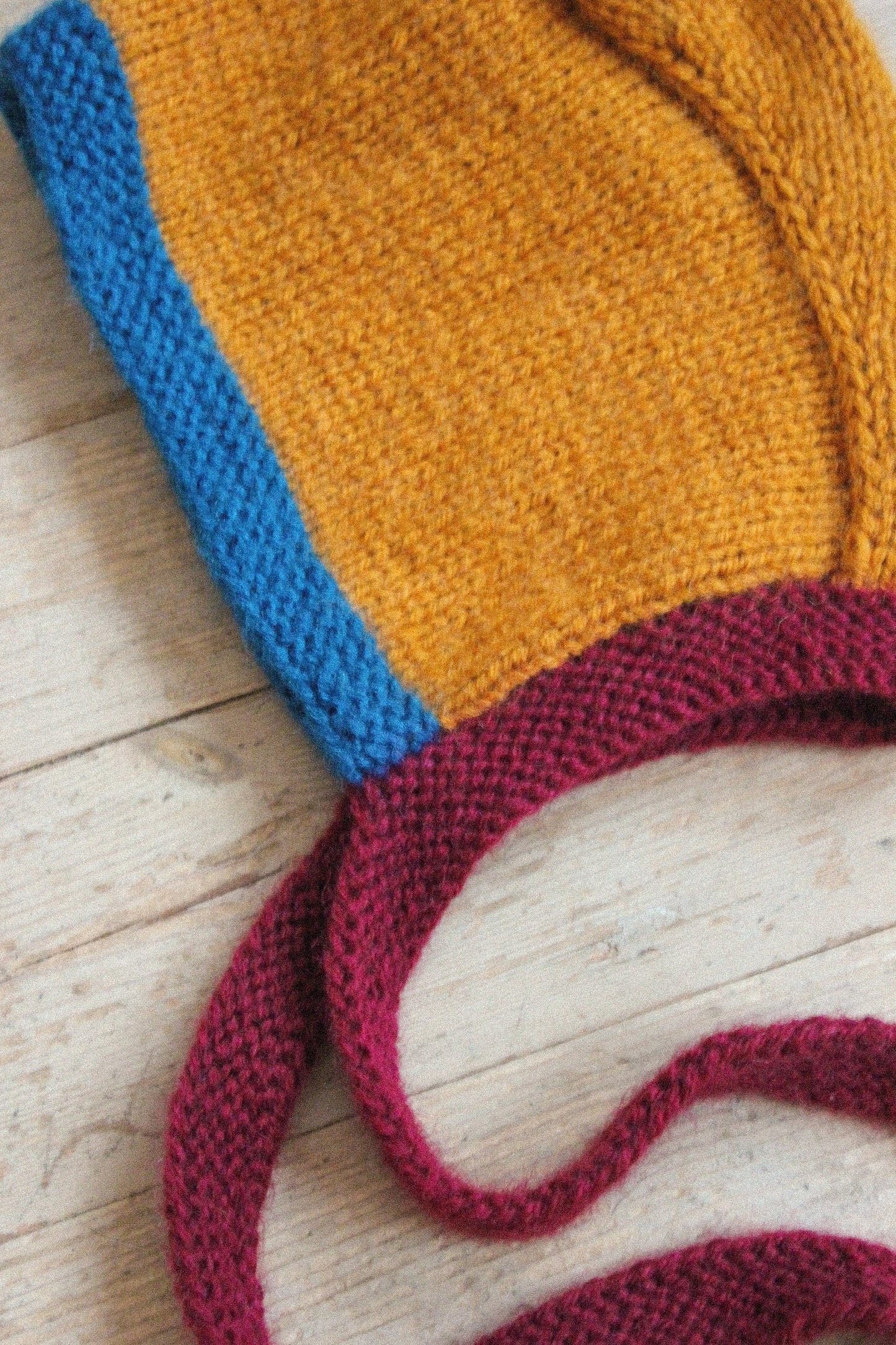 Hand-knitted Adult Bow Tie Bonnet hat in dull multicolor