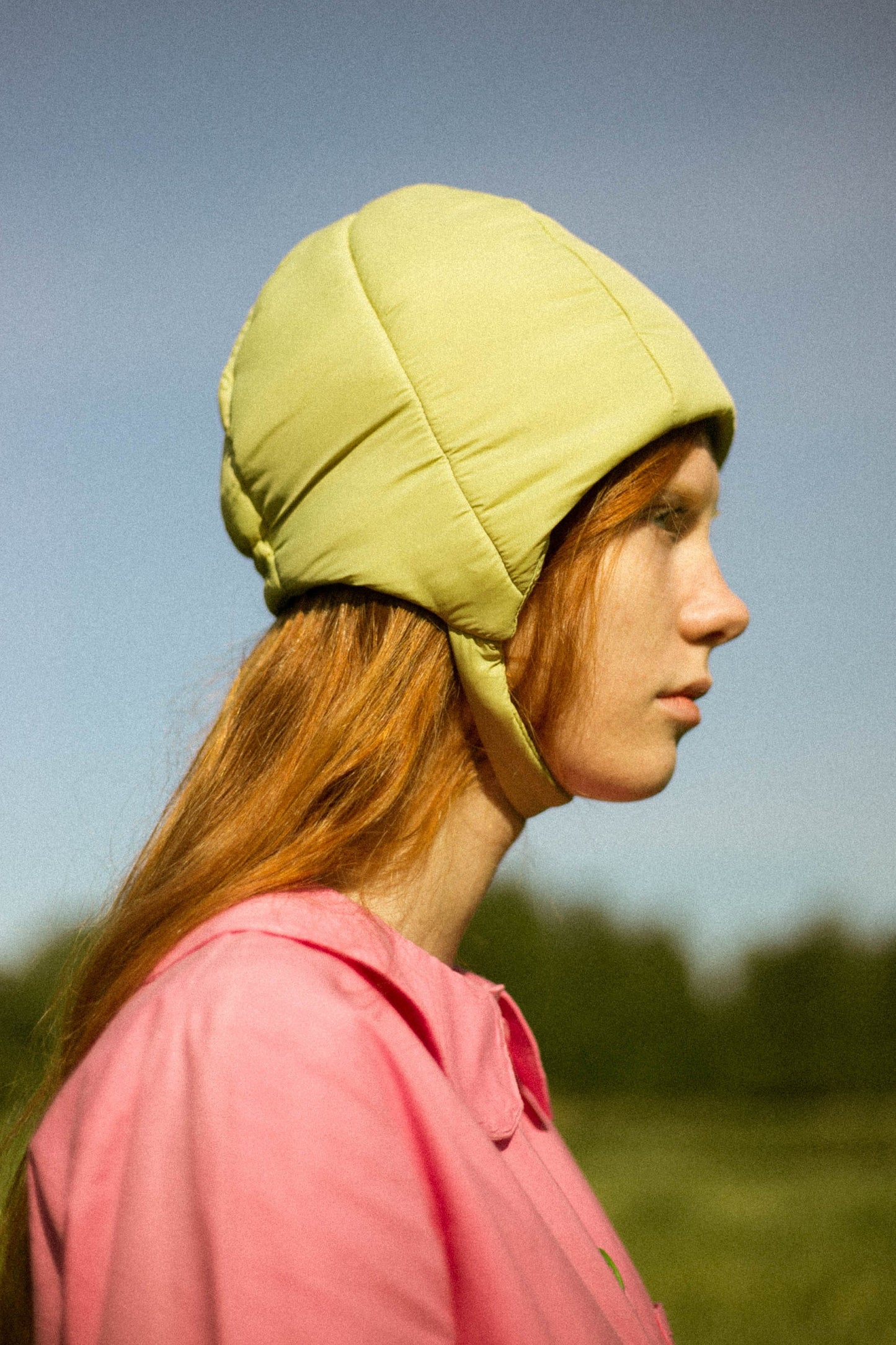 Pillow Puffer Quilted Aviator Helmet Cap Bonnet on a button in light Olive green