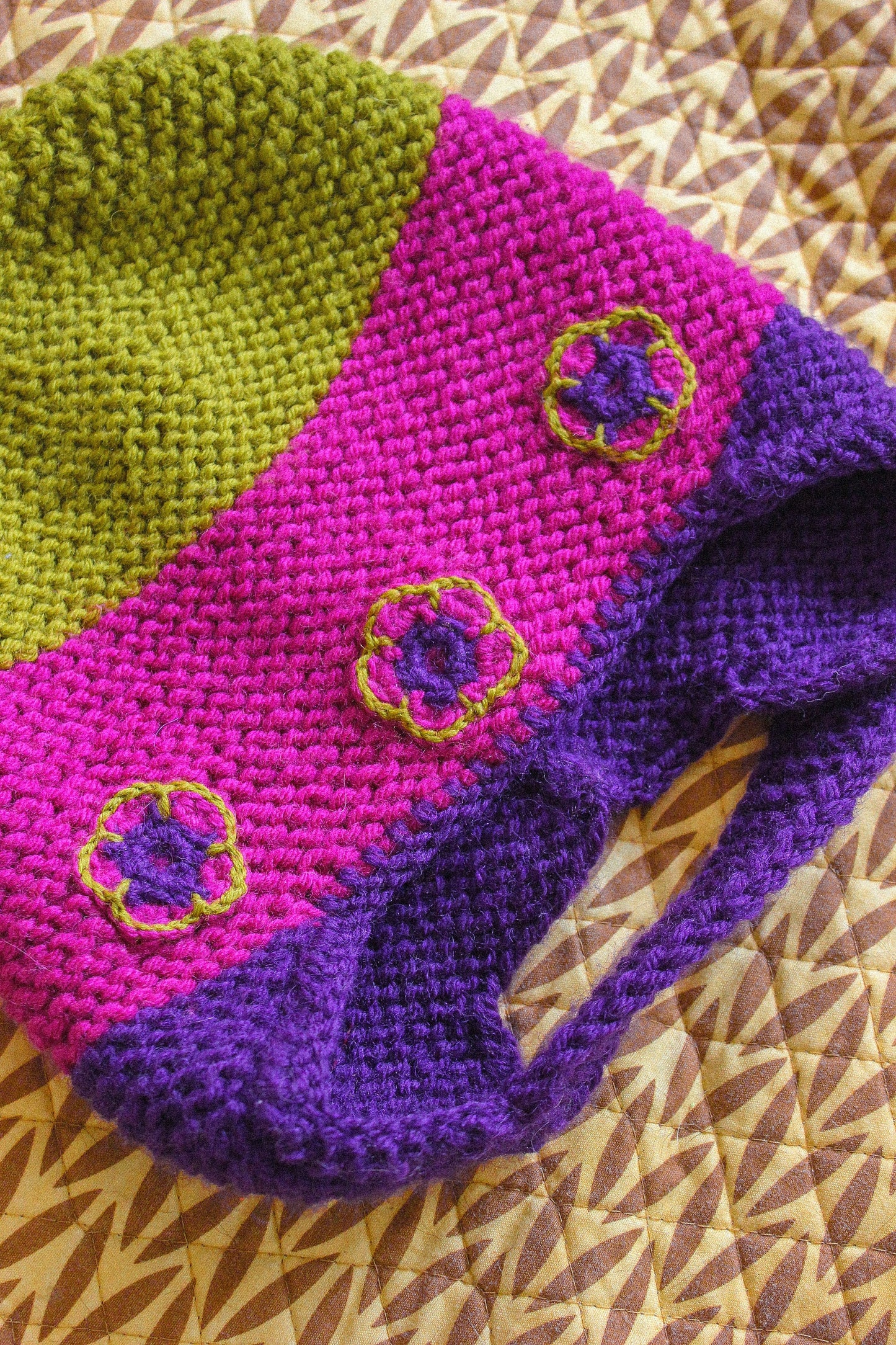 Multicolored Aviator Bonnet Hat with crochet flowers