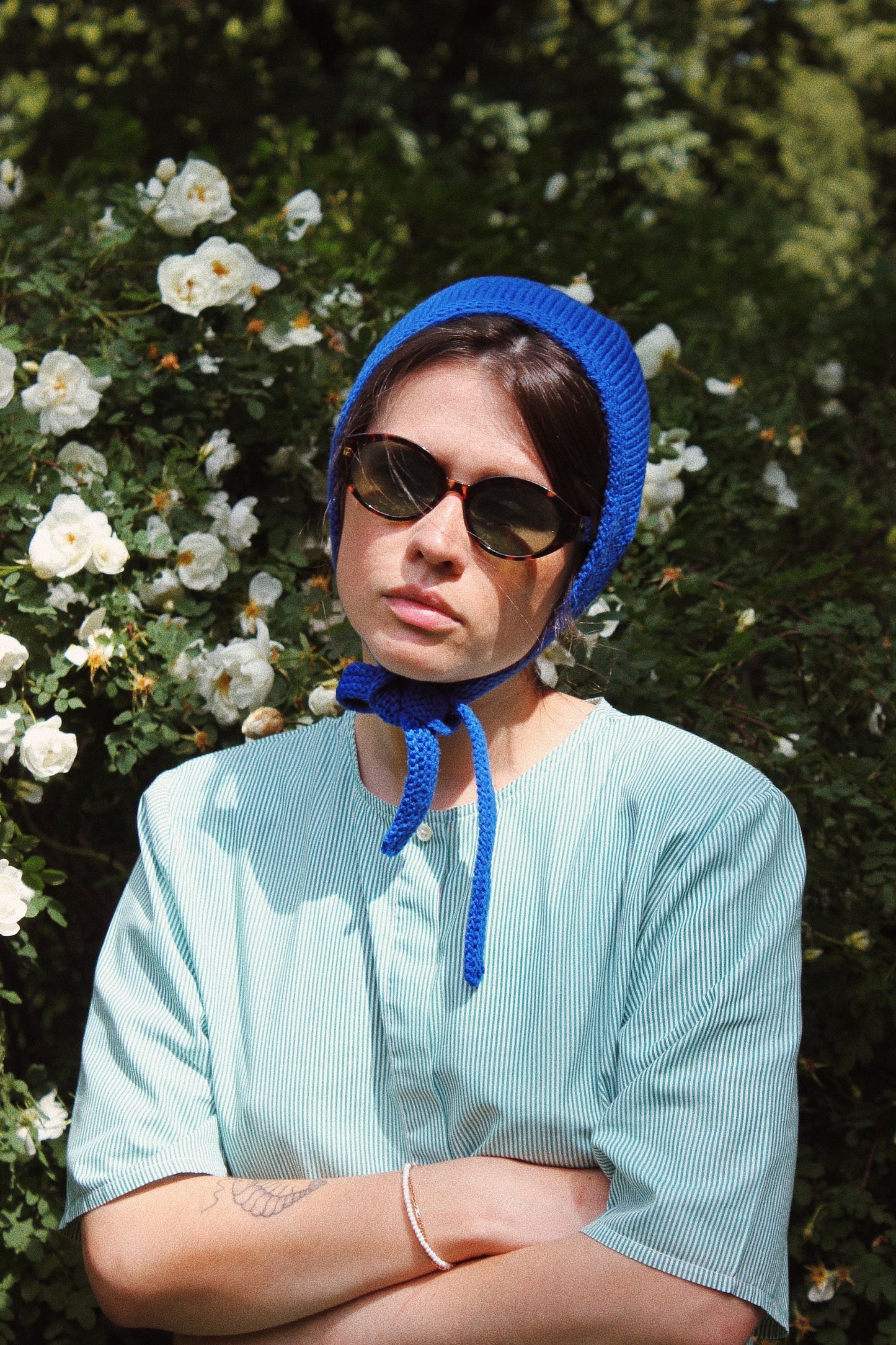 Hand-knitted Adult Bow Tie Bonnet hat in blue