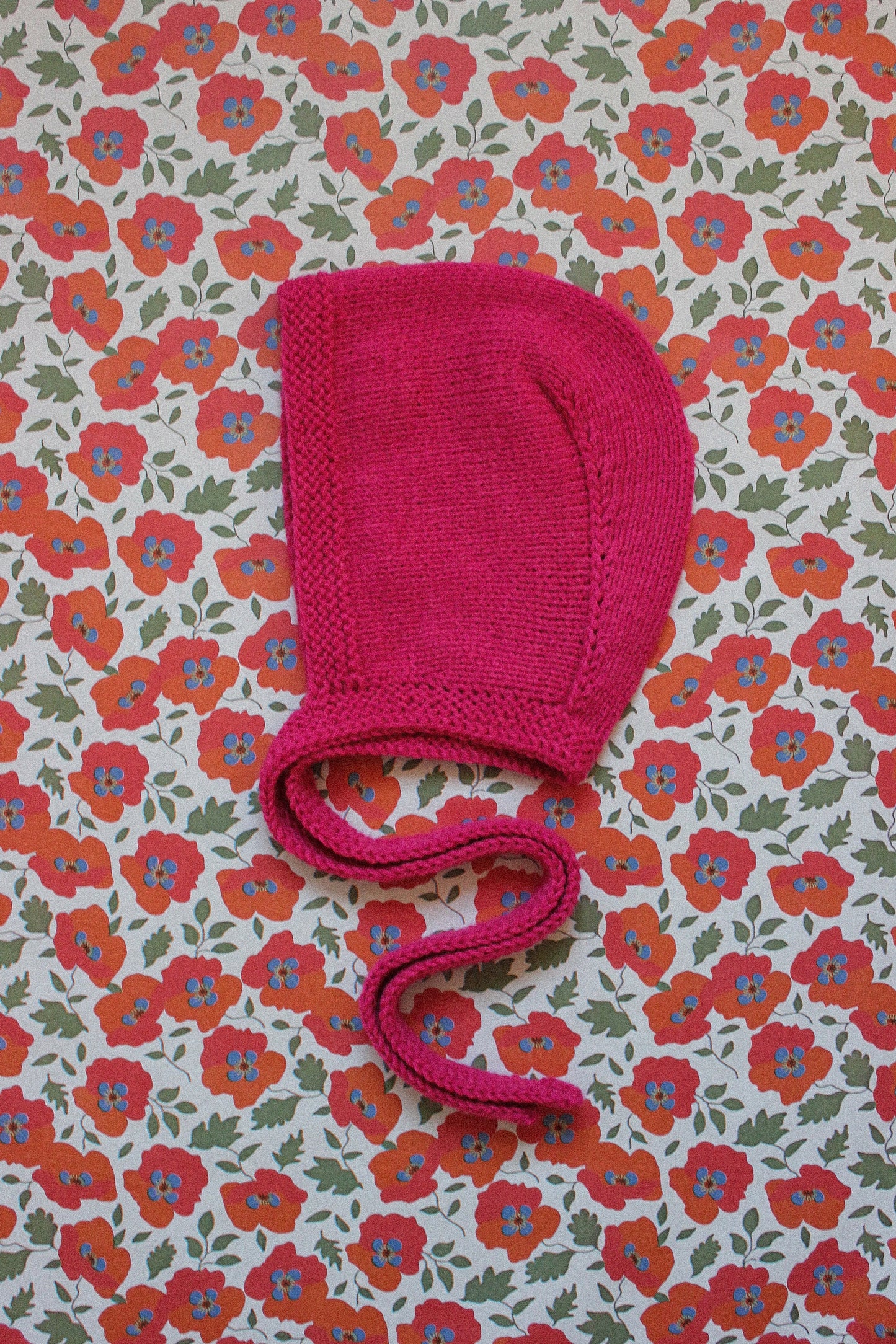 Hand-knitted Adult Bow Tie Bonnet hat in Hot Pink