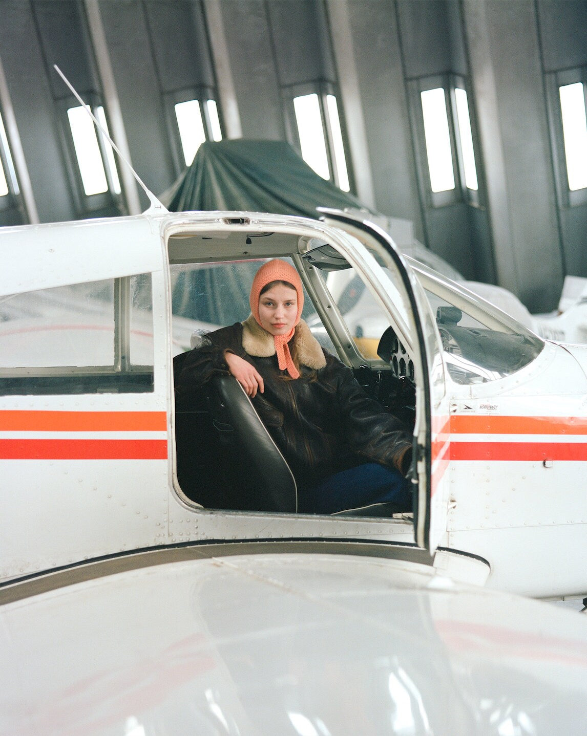 Hand-knitted Adult Bow Tie Bonnet hat in Peach Fuzz