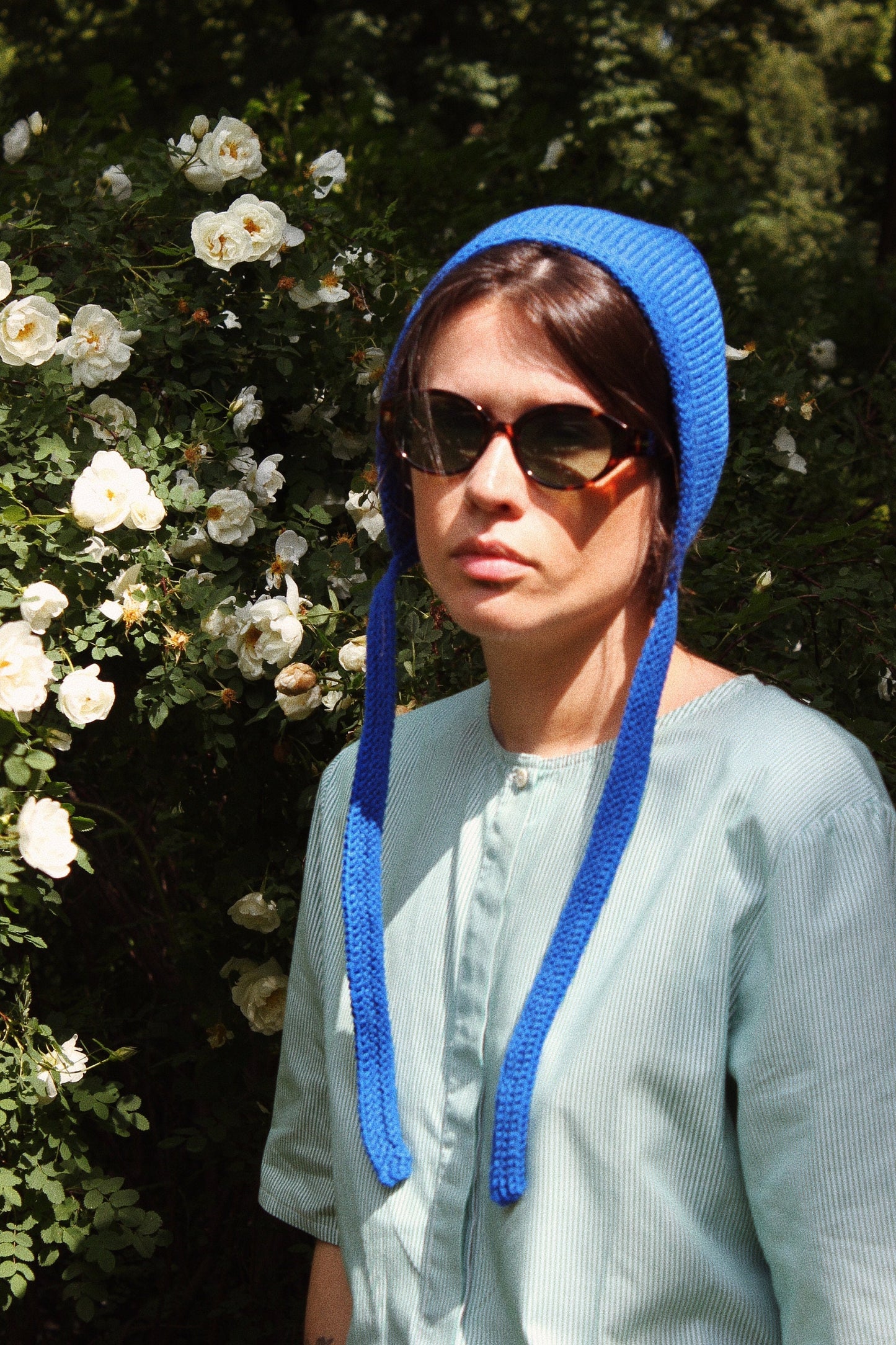 Hand-knitted Adult Bow Tie Bonnet hat in blue