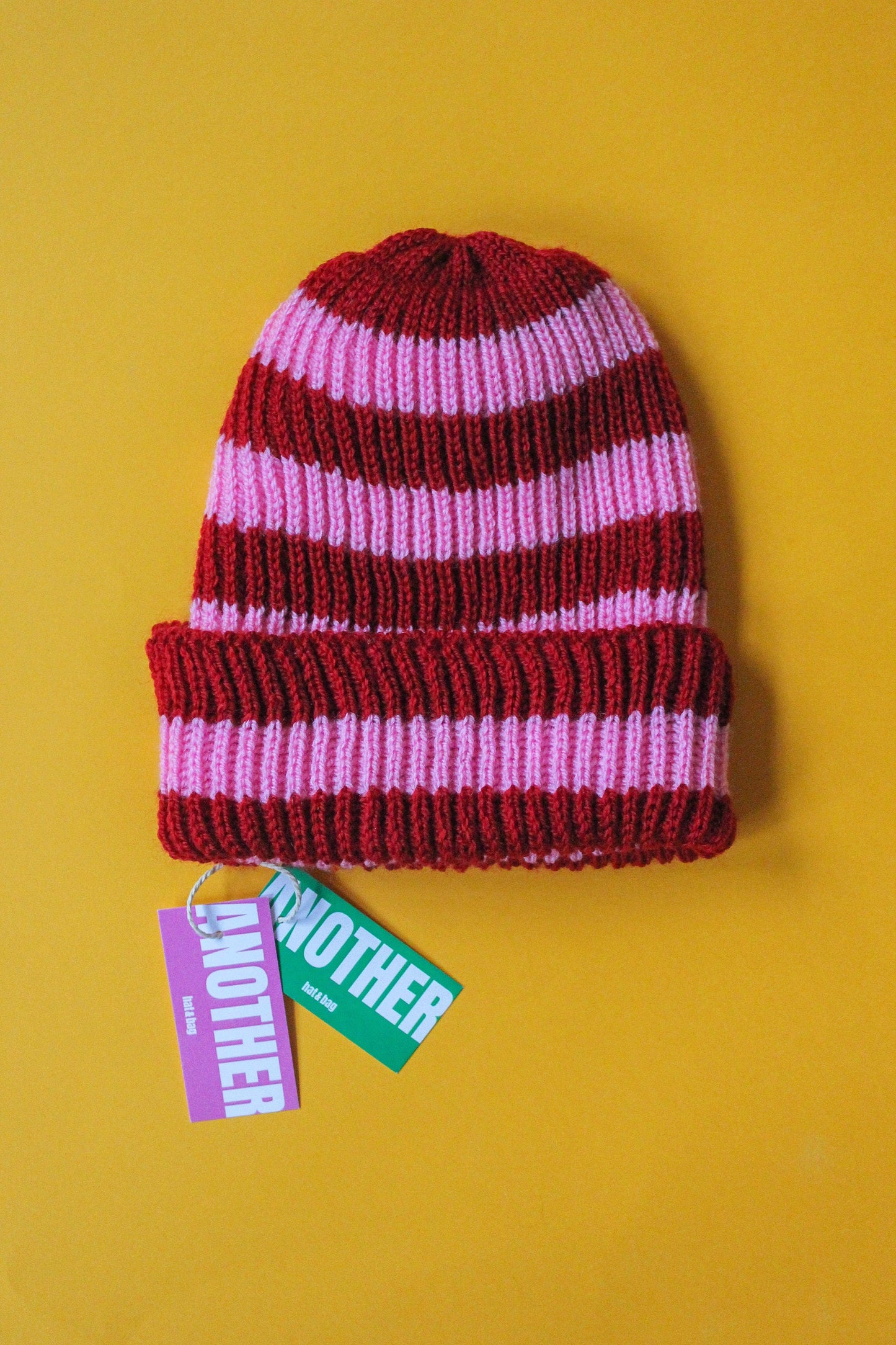 Stripped beanie hat in red and pink