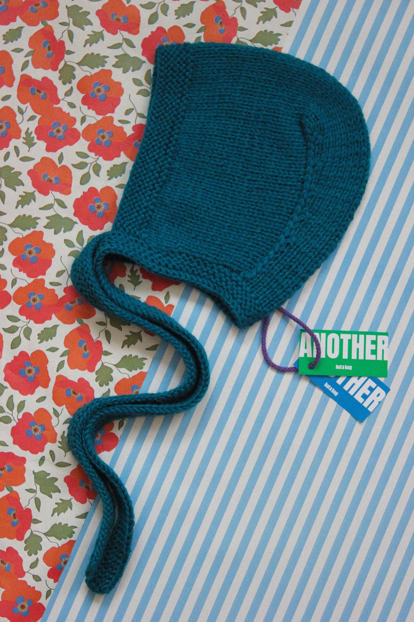 Hand-knitted Adult Bow Tie Bonnet hat in Ocean Blue