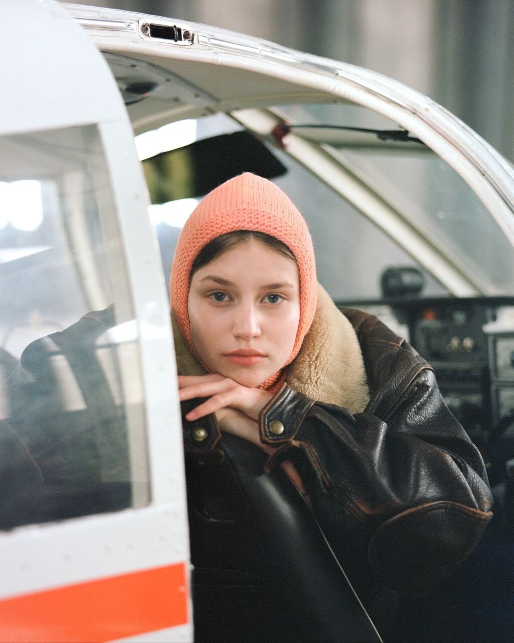 Hand-knitted Adult Bow Tie Bonnet hat in Peach Fuzz