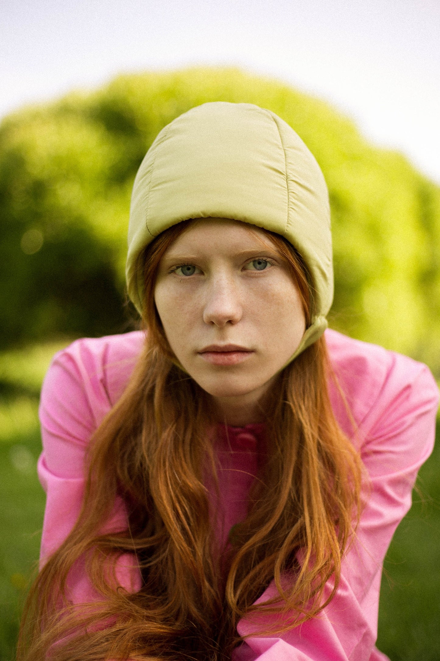 Pillow Puffer Quilted Aviator Helmet Cap Bonnet on a button in light Olive green