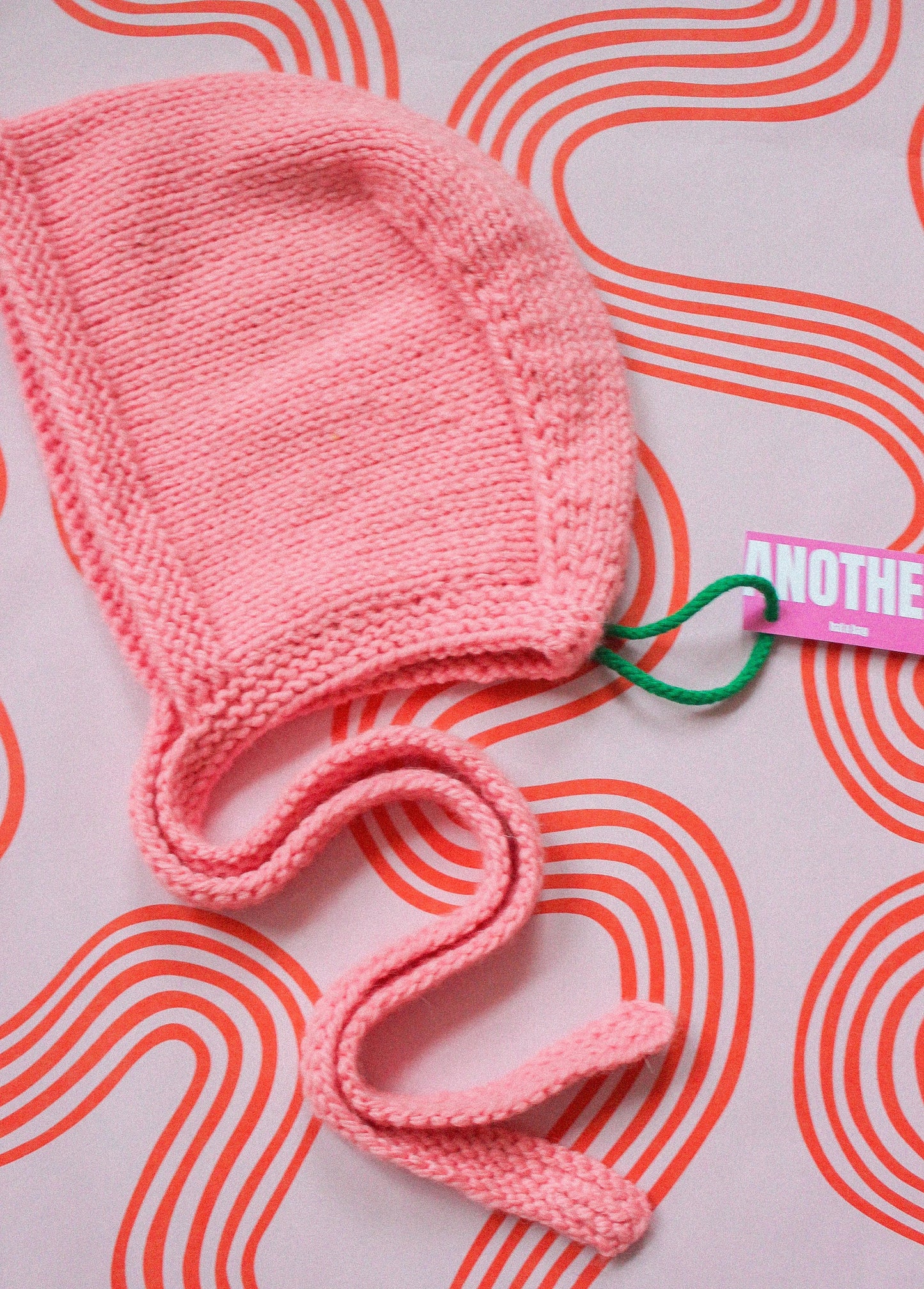 Hand-knitted Adult Bow Tie Bonnet hat in pink
