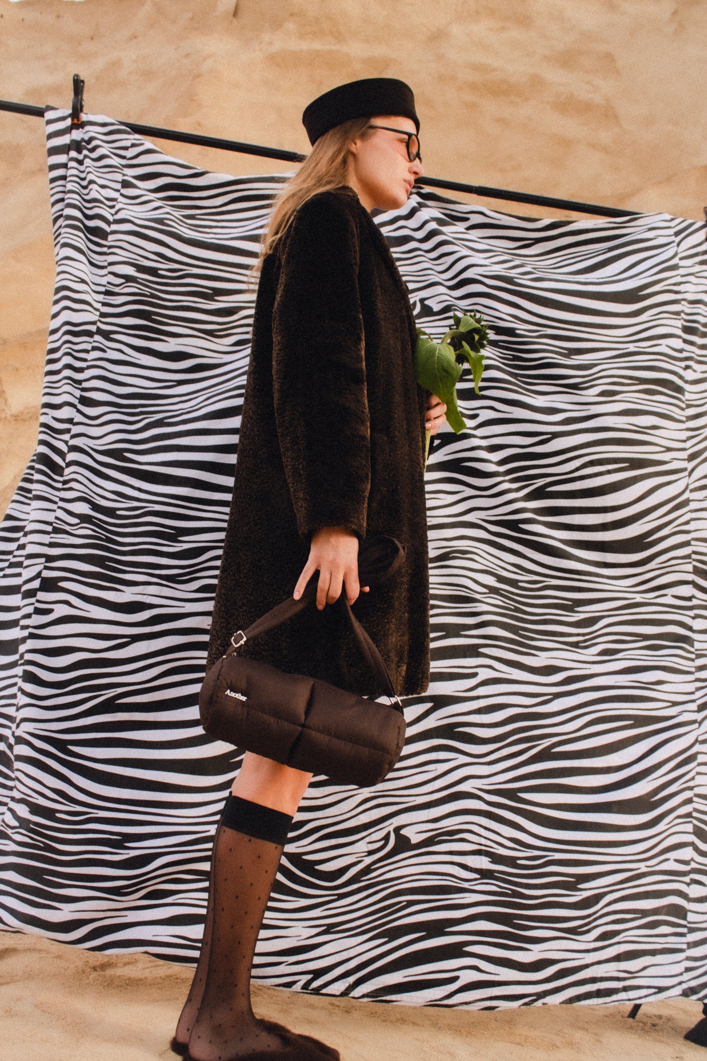 Pillow Puffer Cylinder bag in brown