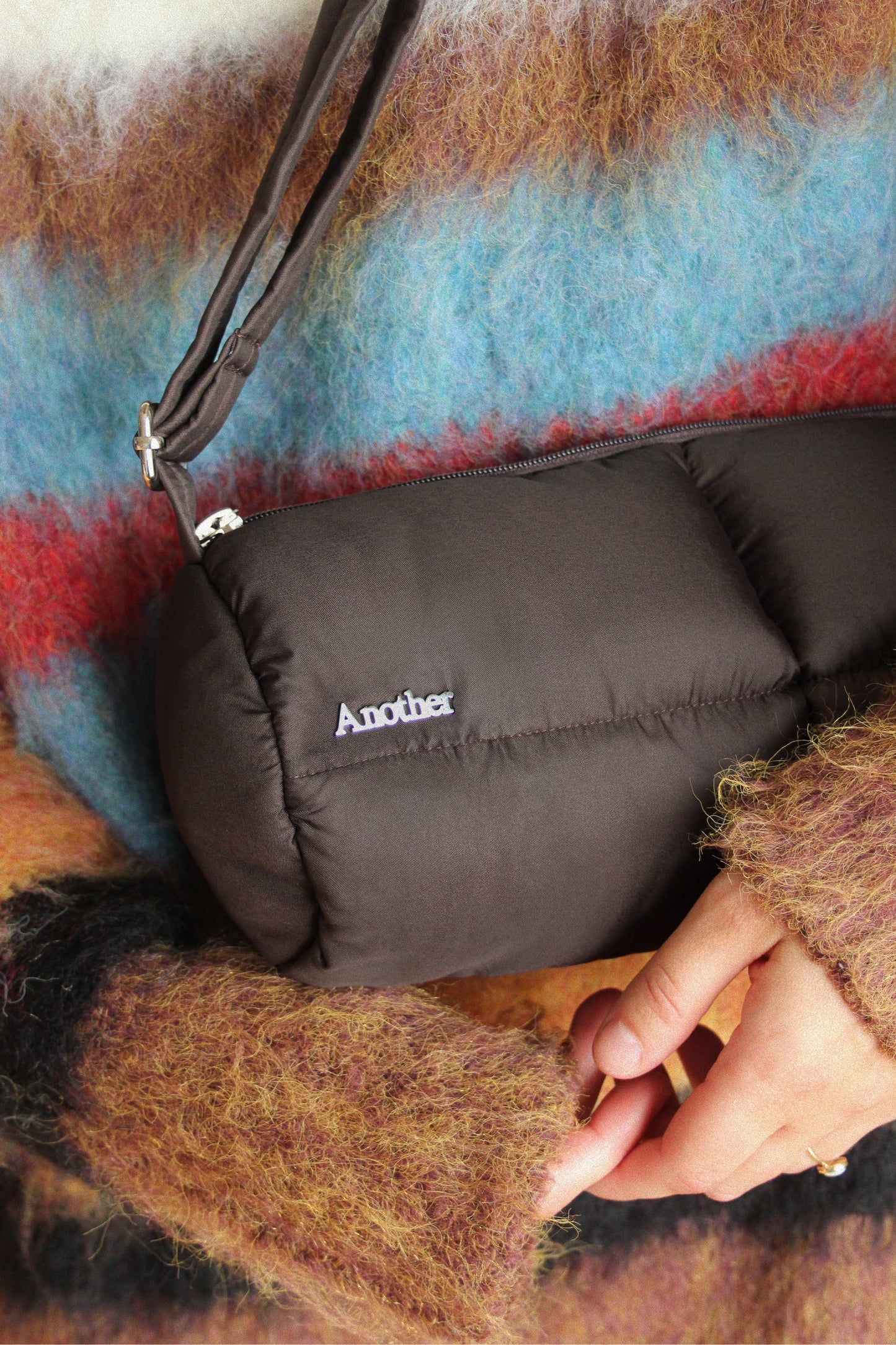 Pillow Puffer Cylinder bag in brown