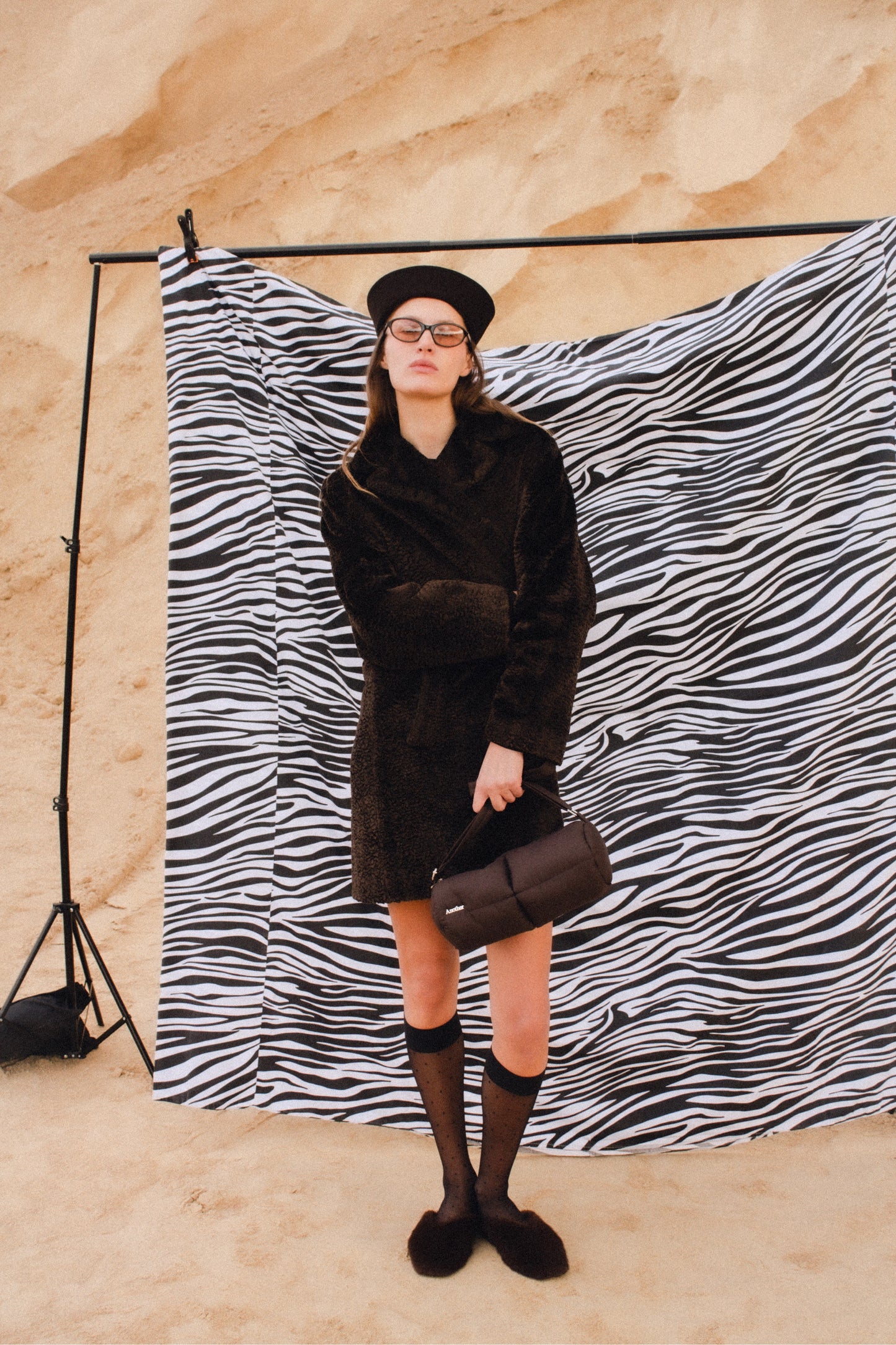 Pillow Puffer Cylinder bag in brown