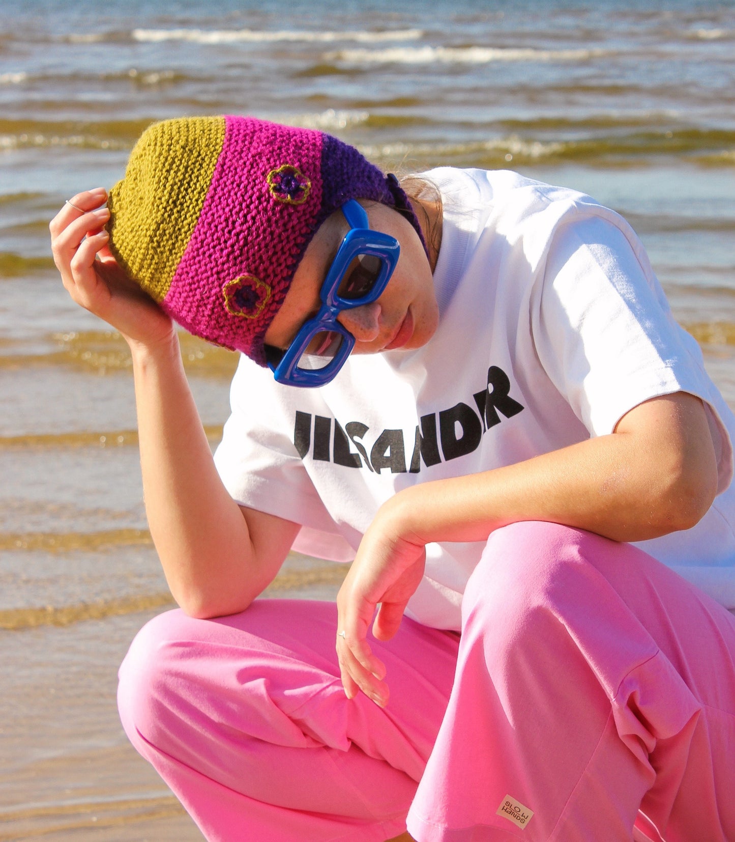 Multicolored Aviator Bonnet Hat with crochet flowers