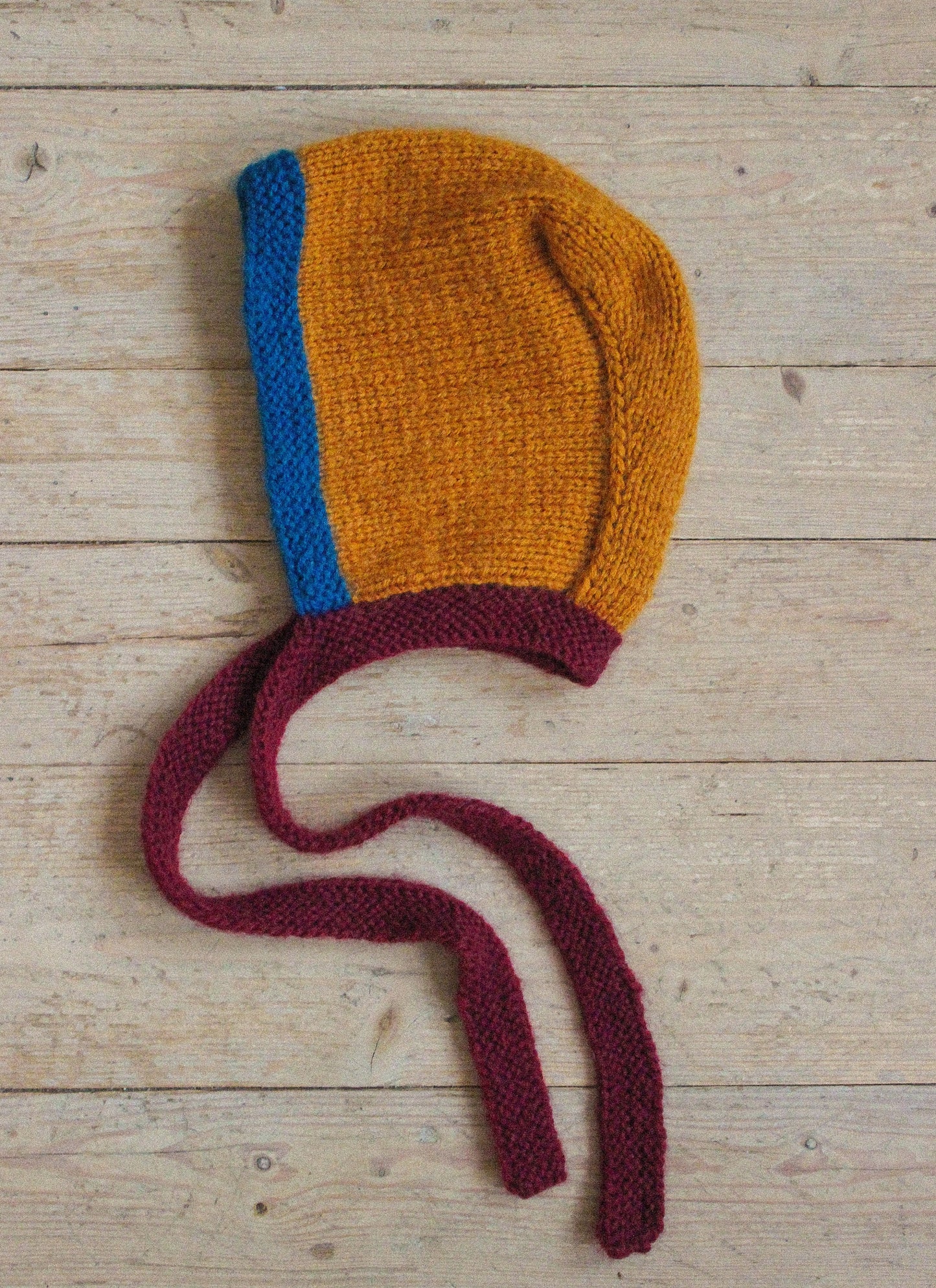 Hand-knitted Adult Bow Tie Bonnet hat in dull multicolor