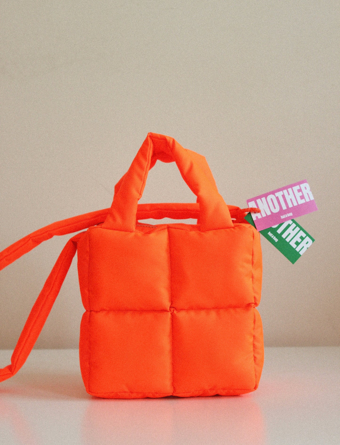 Mini Pillow Puffer Essential bag in Neon Mandarin