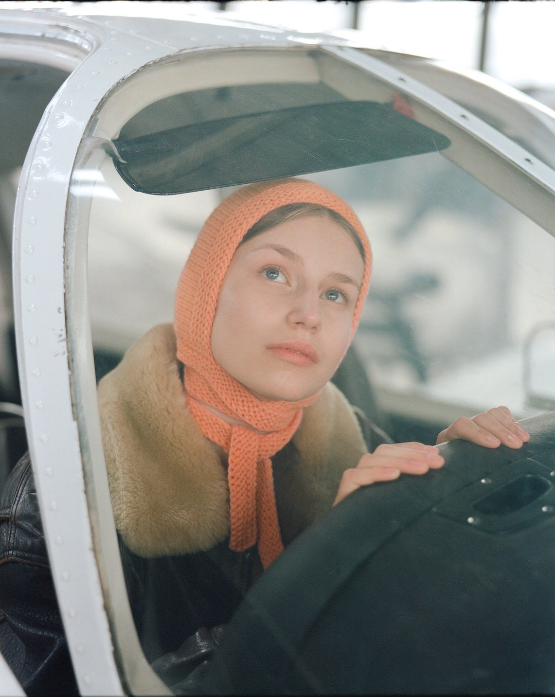 Hand-knitted Adult Bow Tie Bonnet hat in Peach Fuzz