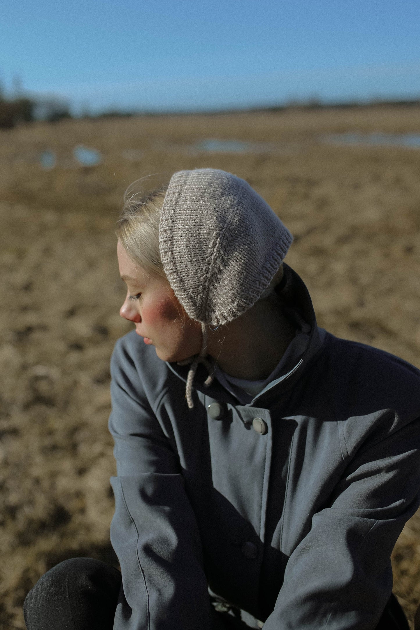 Handknitted Adult Bow Tie Bonnet in Beige