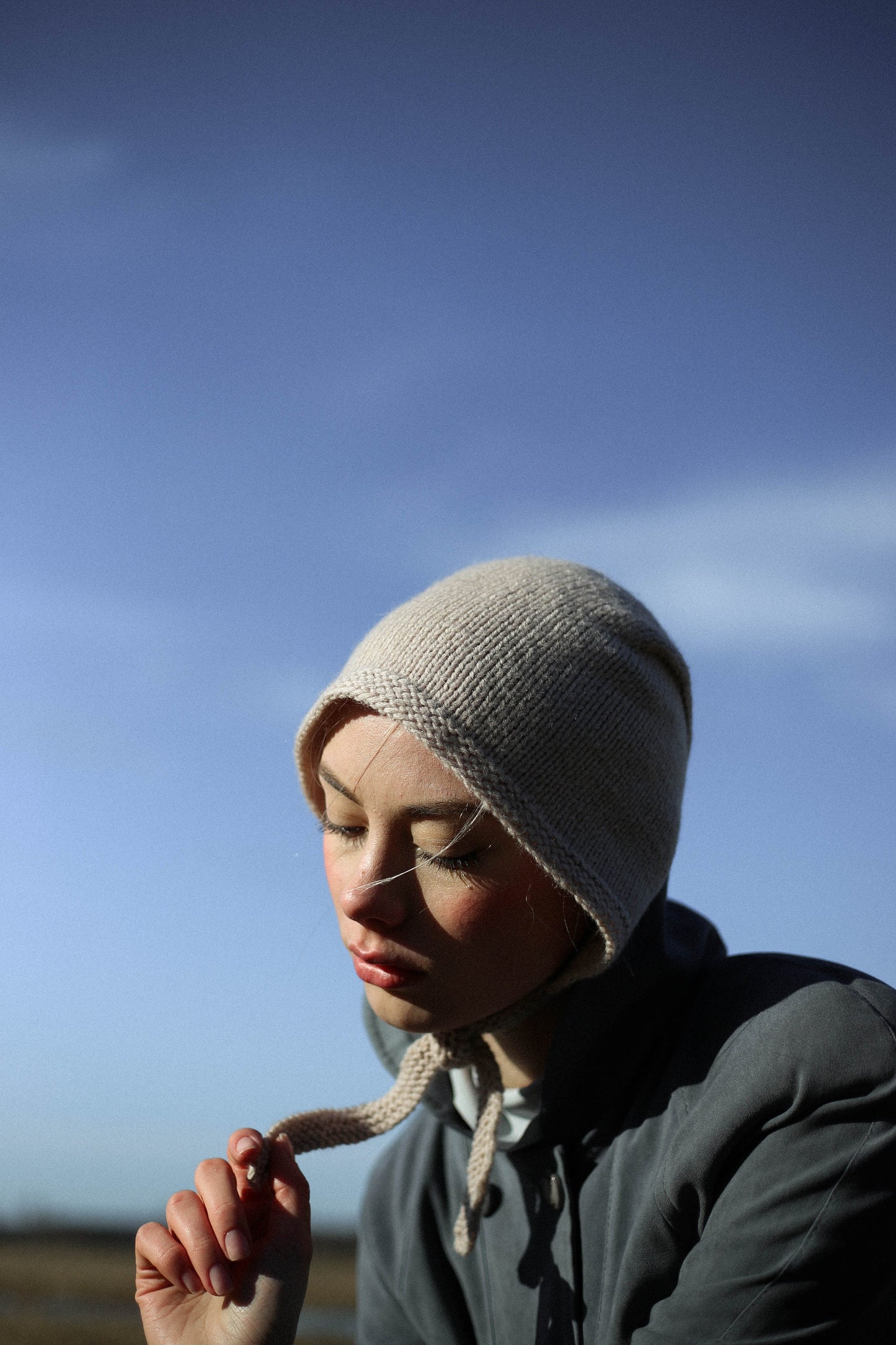 Hand-knitted Adult Bow Tie Bonnet hat in cream beige