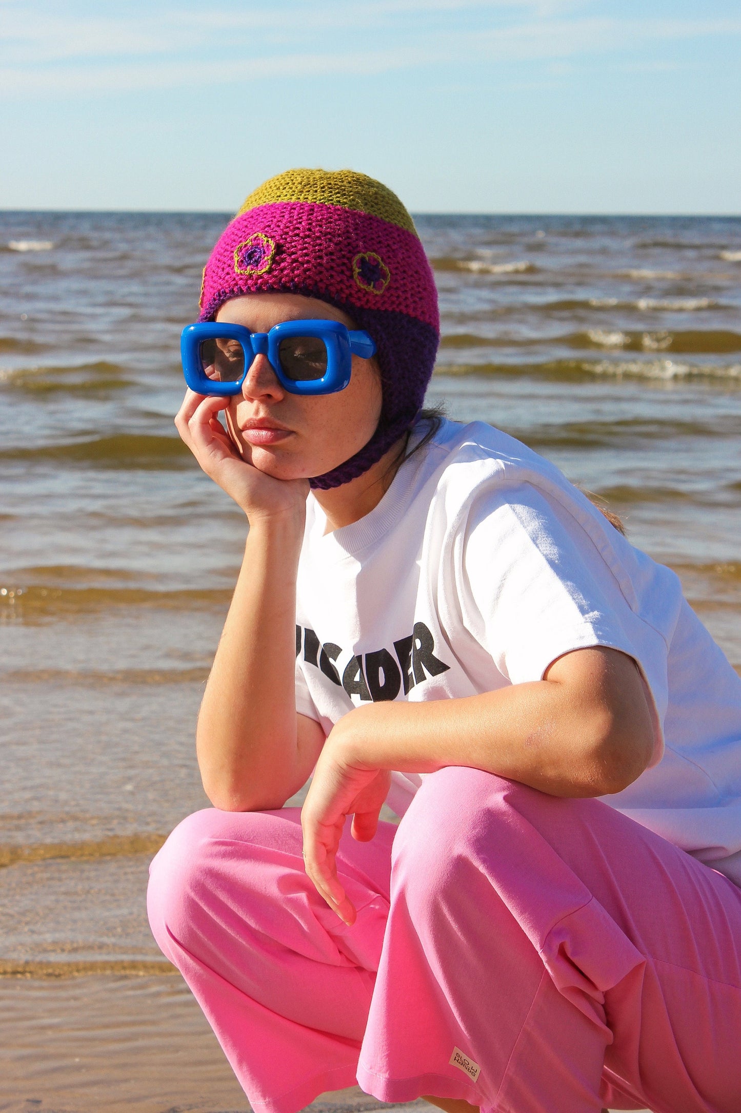 Multicolored Aviator Bonnet Hat with crochet flowers