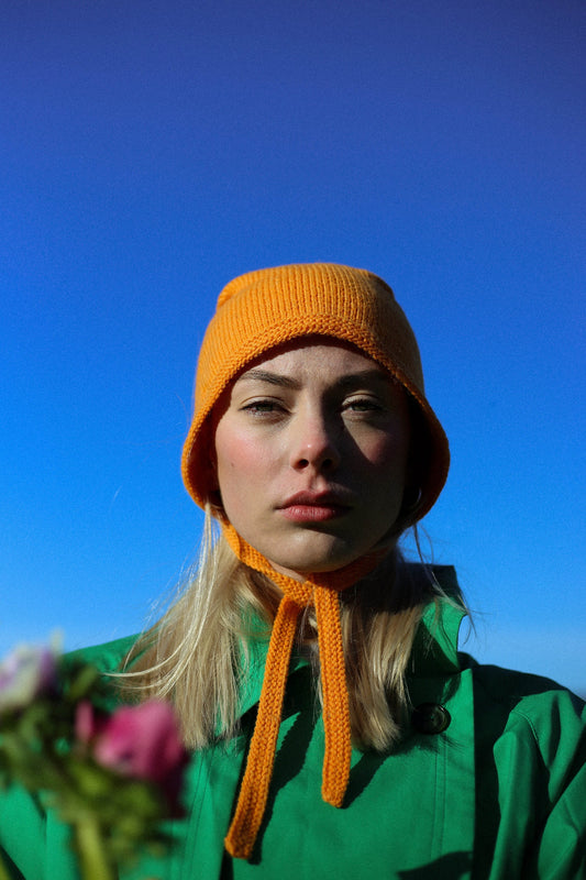 Hand-knitted Adult Bow Tie Bonnet hat in mandarin orange