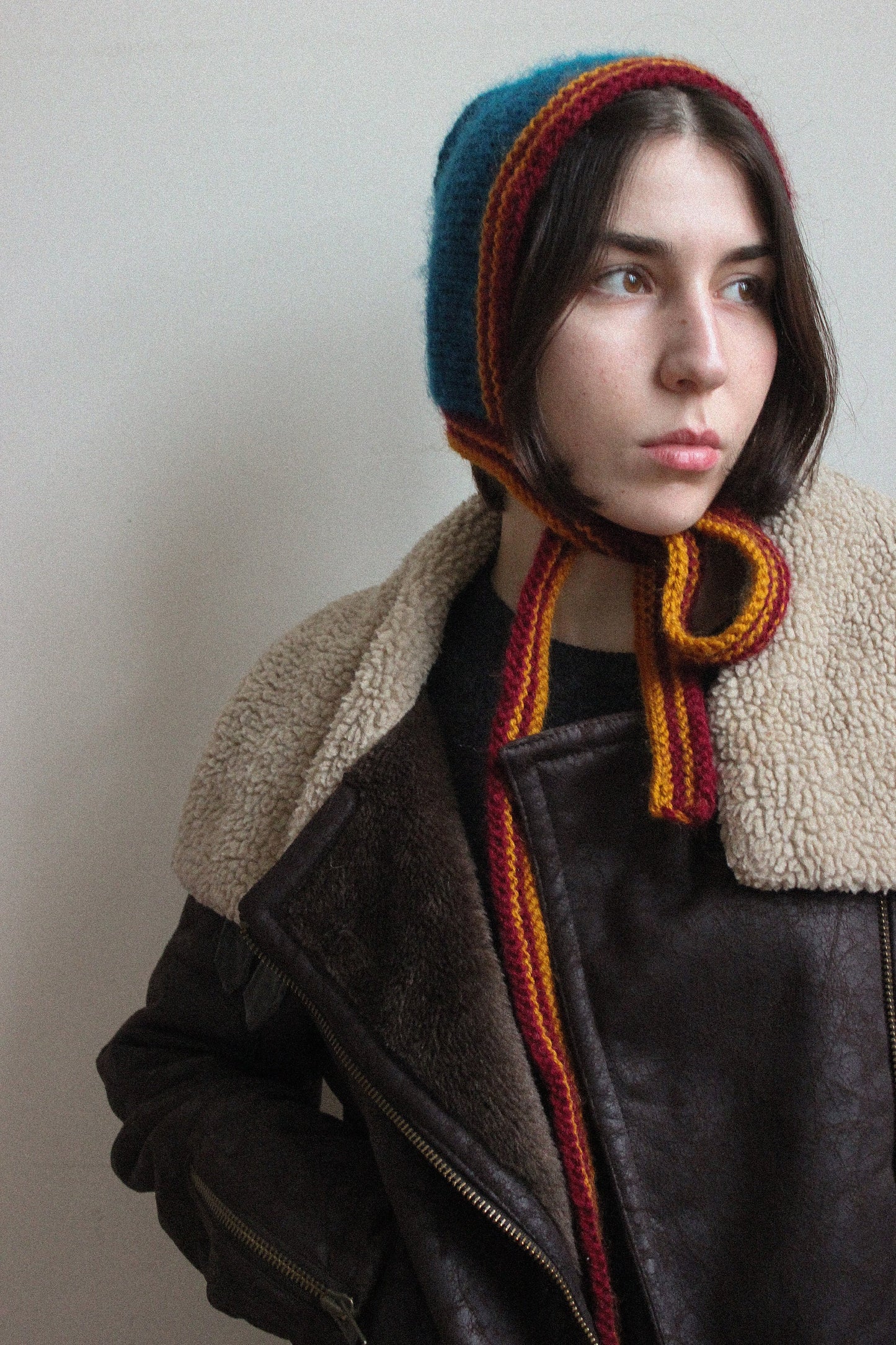 Hand-knitted Adult Bow Tie Bonnet hat in dull multicolor